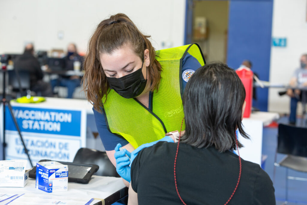 DePaul nursing student administers a vaccine